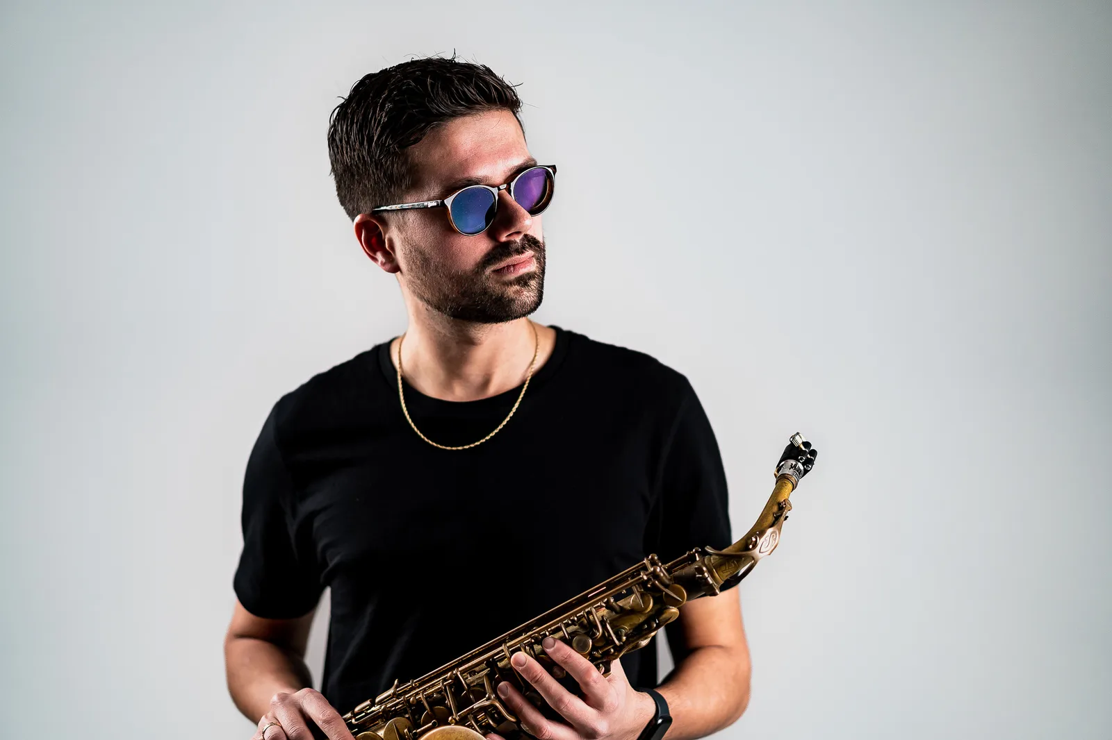 Live saxophone performance photographed by Raid Media